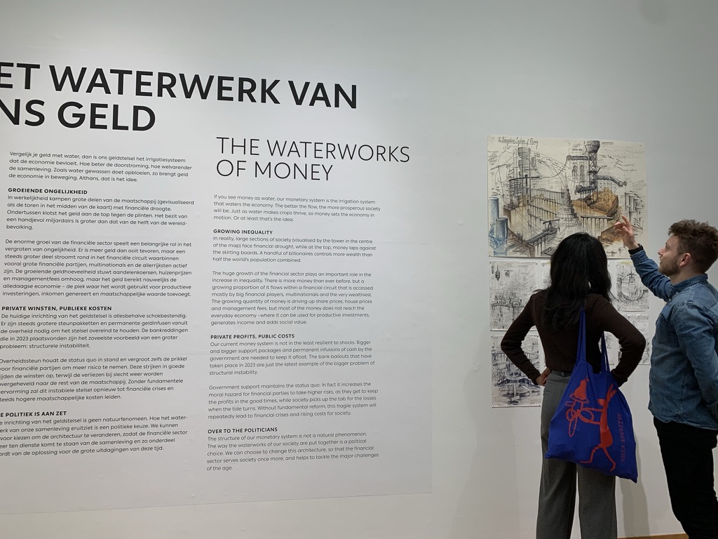 Visitors reading The Waterworks of Money exhibition wall